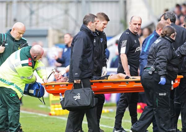 League two -  Hartlepool United vs Portsmouth - 01/04/17
PortsmouthÃ¢Â¬"s Noel Hunt dislocated shoulder and has to be stretchered off watched by PortsmouthÃ¢Â¬"s Manager Paul Cook PPP-170304-122209001