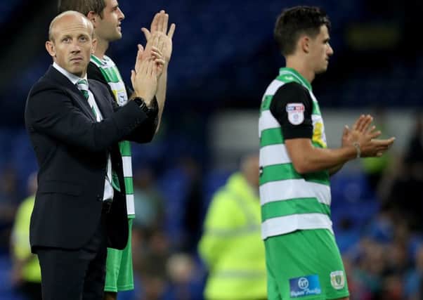 Yeovil Town's manager Darren Way (centre) acknowledges the fans after the final whistle during the EFL Cup, Second Round match at Goodison Park, Liverpool. PPP-161229-125803002