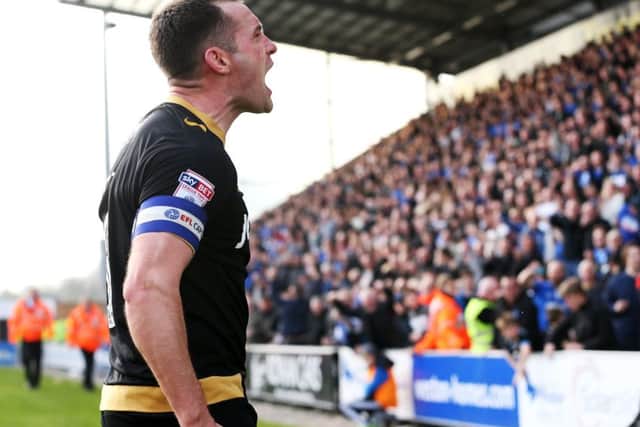 Michael Doyle celebrates scoring in Pompey's win against Colchester. Picture: Joe Pepler