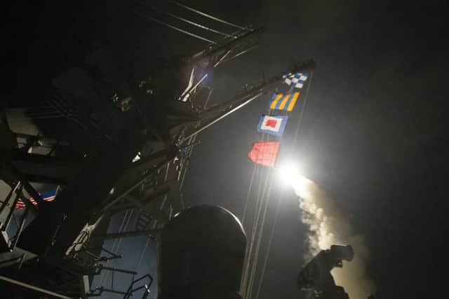 The USS Ross fires a Tomahawk land attack missile from the Mediterranean Sea during the attack on the Syrian air base (US Navy/AP)