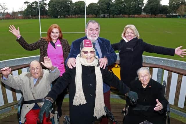 Resident Josie Allman, centre, tried on some rugby headgear and is pictured with fellow residents Paul Harvey and Bunny Storrar, activities organiser Emily Hudson, Ron Migliorini and home manager Clare Gibson