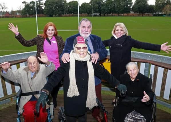 Resident Josie Allman, centre, tried on some rugby headgear and is pictured with fellow residents Paul Harvey and Bunny Storrar, activities organiser Emily Hudson, Ron Migliorini and home manager Clare Gibson