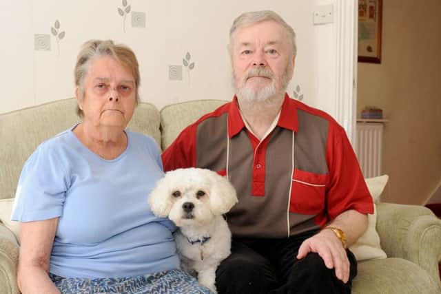 Hilary and Douglas Laver with their dog Charlie Picture: Sarah Standing (170389-4099)