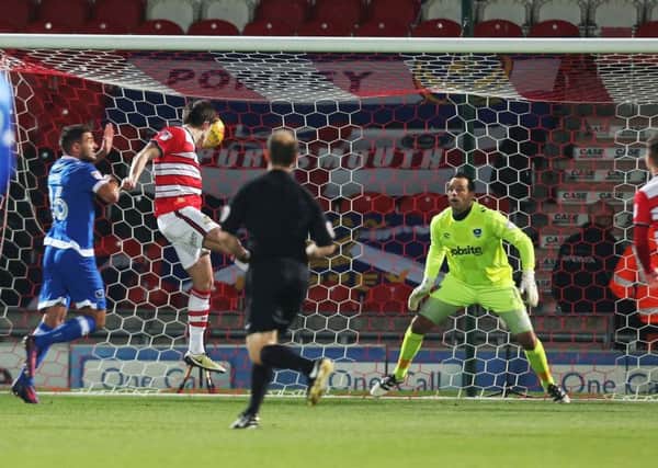 DONCASTER, UK, 5TH JANUARY, 2017.
Doncaster's John Marquis scores his first goal of the match during the Sky Bet League 2 match between Doncaster Rovers and Portsmouth at the Keepmoat Stadium, Doncaster, England on 5 January 2017. Photo by Joe Pepler/Digital South. PPP-170501-200138006