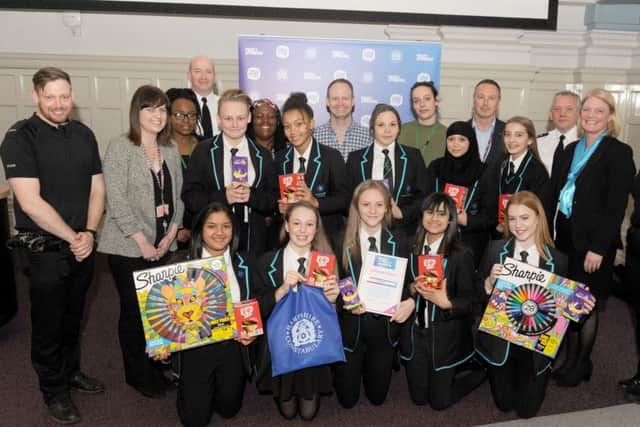 Judges, police and pupils from the winning school, Portsmouth Academy, with their prizes.  Picture: Sarah Standing (170470-5792)