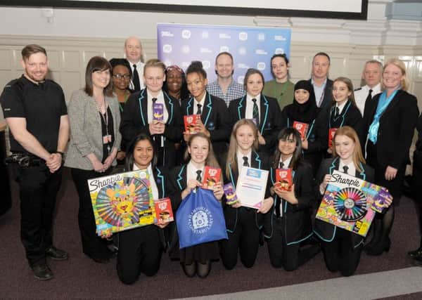 Judges, police and pupils from the winning school, Portsmouth Academy, with their prizes.  Picture: Sarah Standing (170470-5792)