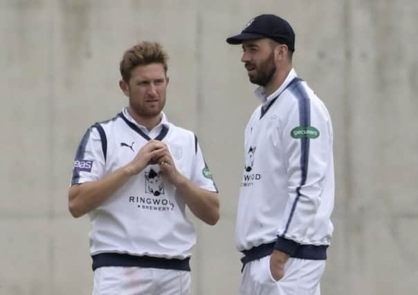 Liam Dawson with Hampshire skipper James Vince. Picture: Neil Marshall
