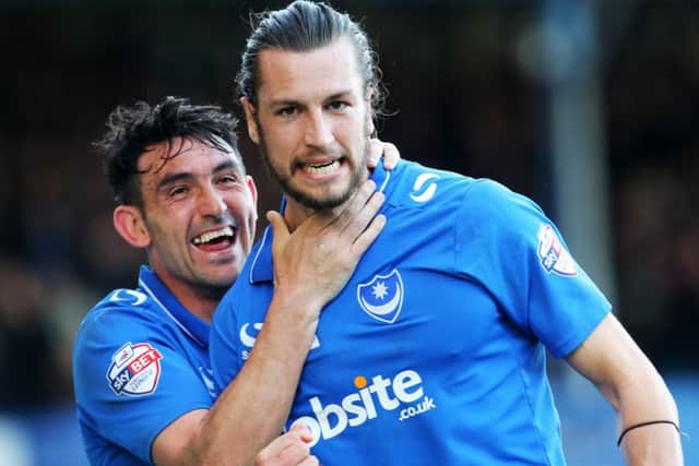 Christian Burgess celebrates with Gary Roberts. Picture: Joe Pepler