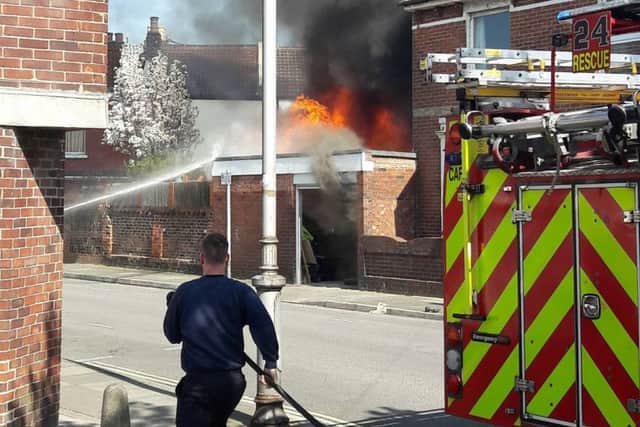 Firefighters battle a garage blaze at Lincoln Road, Fratton, on April 7. Picture: Mirek Plotek