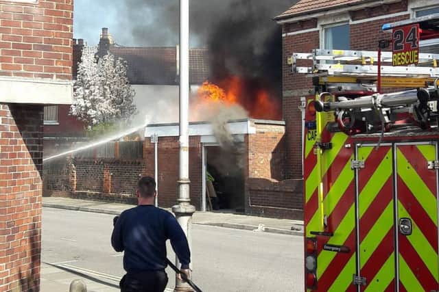 Firefighters battle a garage blaze at Lincoln Road, Fratton  Picture: Mirek Plotek