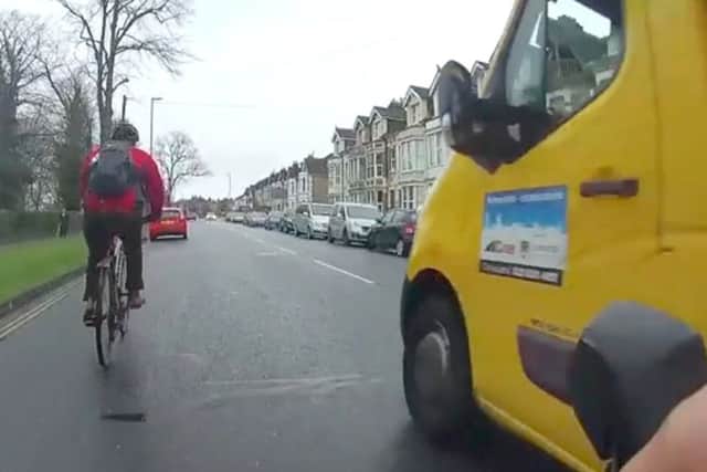 A Colas truck overtaking two cyclists, including the undercover police cyclist