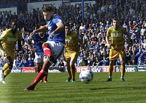 Gareth Evans scores from the penalty spot for Pompey. Picture: Joe Pepler