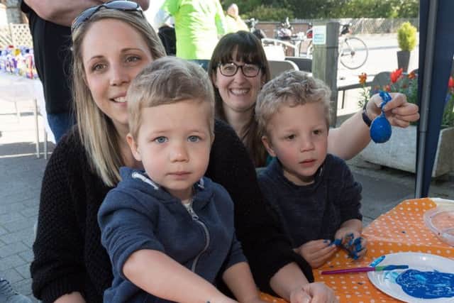 Emma Harding with Oliver,two, and Jake, four.  with Jenni Moore (back right)  from the Denmead Infant School PTA Photo: Keith Woodland 170431
