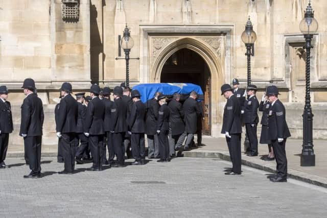 The coffin of PC Keith Palmer passing a police guard of honour as it arrives at Westminster's Chapel of St Mary Undercroft in London, where he will rest overnight ahead of a full police funeral at Southwark Cathedral. Picture: Paul Grover/Daily Telegraph/PA Wire