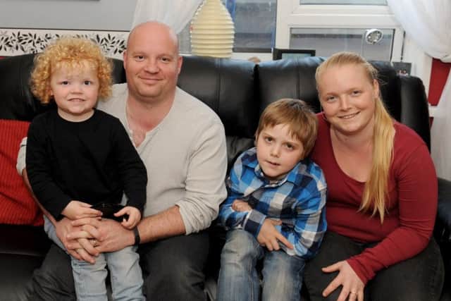Jo Jelly, her partner Carl Mason and children Ethan, three, and Dennis, eight Picture: Sarah Standing (170459-5304)