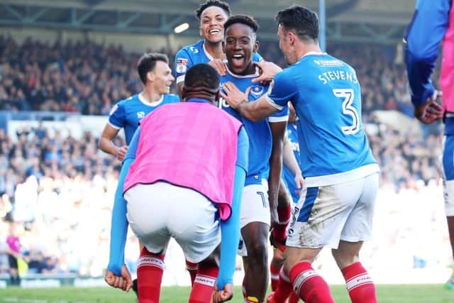 Jamal Lowe runs to fellow sub Nicke Kabamba after scoring on Saturday. Picture: Joe Pepler
