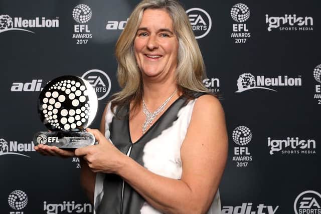 Pompey in the Community's Clare Martin collecting the Checkatrade Community Club of the Year award