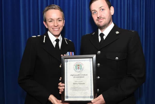 PC Barry Watson receiving the commendation from chief constable OIivia Pinkney