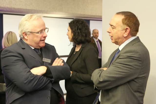 Prof Davis, left, with Lord Bourne, discussing community innovation