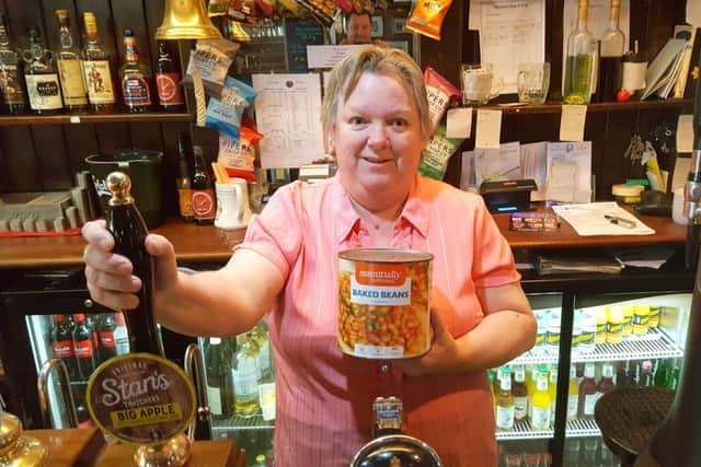 Landlady Marilyn Forster is preparing to wallow in a bath of baked beans for charity