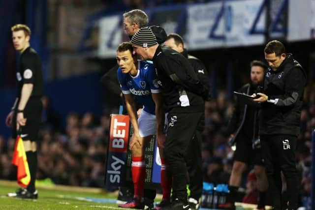 Kal Naismith and Pompey boss Paul Cook. Picture: Joe Pepler