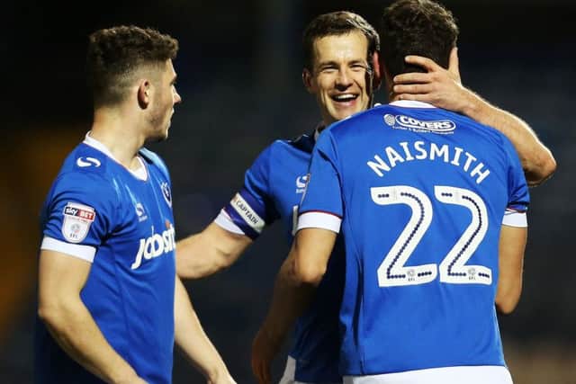Michael Doyle congratulates Kal Naismith on a goal. Picture: Joe Pepler