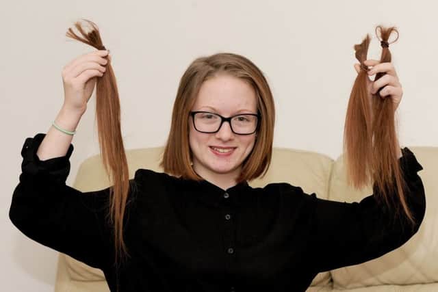 17/3/2017 (TS)Jasmine Bone (13) from Leigh Park, had eleven and a half inches of her hair cut off for the Little Princess Trust. Jasmine donated her hair back in 2013 to the Little Princess Trust also. Picture: Sarah Standing (170404-8406) PPP-170320-115529001