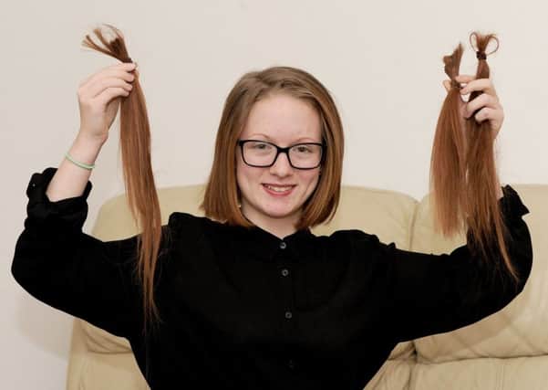17/3/2017 (TS)

Jasmine Bone (13) from Leigh Park, had eleven and a half inches of her hair cut off for the Little Princess Trust. Jasmine donated her hair back in 2013 to the Little Princess Trust also. 

Picture: Sarah Standing (170404-8406) PPP-170320-115529001
