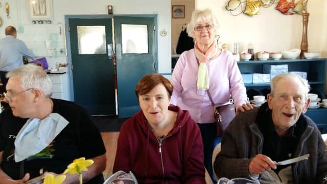 Thelma Turner-Hill, second right, with service users at a lunch for The Fellowship