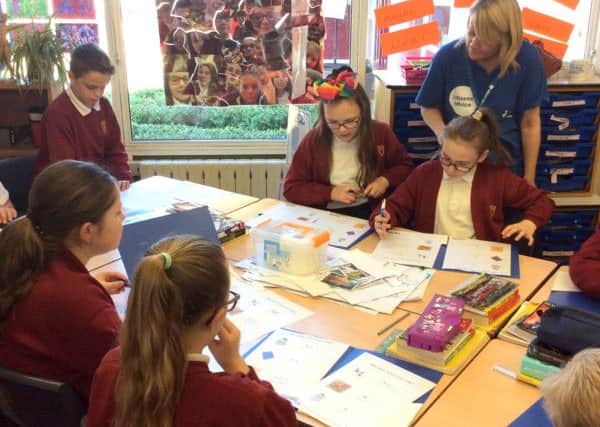 Fiona Ross with pupils at Purbrook Junior School during a Work Out Your Money session