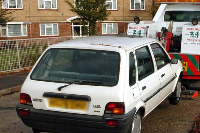 An abandoned car being removed