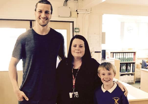 Christian Burgess with teacher Gemma Havey and pupil Kenny Whitear