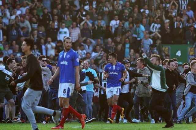 Enda Stevens surrounded by partying Plymouth fans after the play-off semi-final defeat last season. Picture: Joe Pepler
