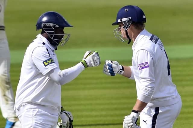 Michael Carberry and Jimmy Adams in action. Picture: Neil Marshall