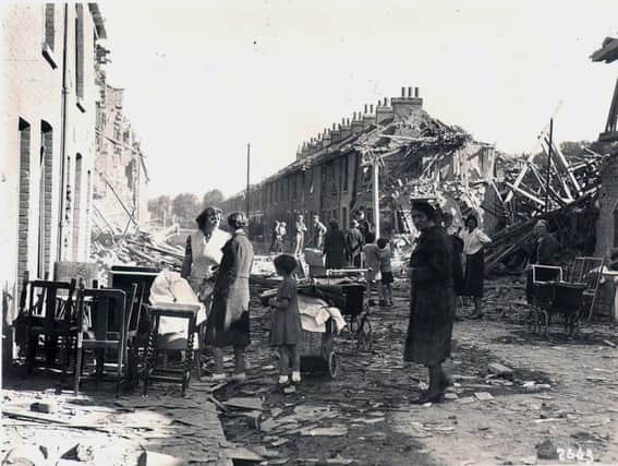 Alan Sanger and his cousin Audrey (with their backs to the camera) are in the centre of this historic blitz picture taken at Fratton.
