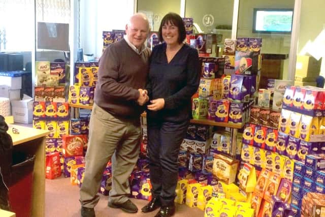 Dave Baker, chairman of CJS Portsmouth with Terri Gray and hundreds of Easter eggs