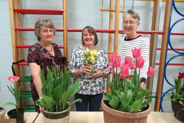 Linda Pridham, Beryl Turner and June Simmon with some of the tulips from Clanfield Gardening Club's spring show
