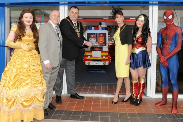 From left, Belle from Beauty and the Beast, operations manager for the Harry Levy Group Karl Vanner, The Lord Mayor and Lady Mayoress of Portsmouth David Fuller and Leza Tremorin,  Wonder Woman and Spiderman. Picture: Sarah Standing (170498-9686)