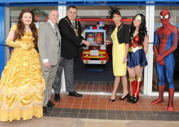 From left, Belle from Beauty and the Beast, operations manager for the Harry Levy Group Karl Vanner, The Lord Mayor and Lady Mayoress of Portsmouth David Fuller and Leza Tremorin,  Wonder Woman and Spiderman. 

Picture: Sarah Standing (170498-9686)