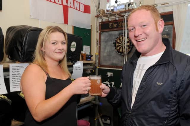 Hannah Carver serves Mark Bingham, 32, from Gosport.Picture: Sarah Standing (170500-9845)