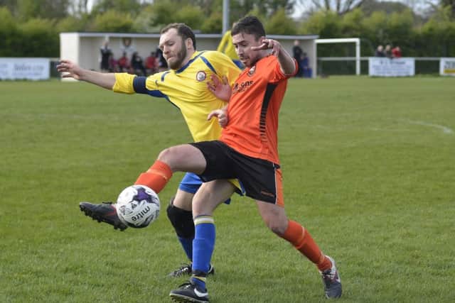 Alex Baldacchino battles for AFC Portchester against Lymington. Picture: Neil Marshall