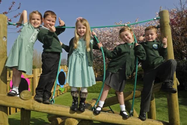 Children at Lee-on-the-Solent Infants School on their new outdoor apparatus Picture: Ian Hargreaves (170345-1)