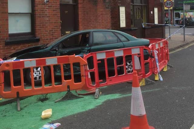 The car after it was pushed into The George and Dragon