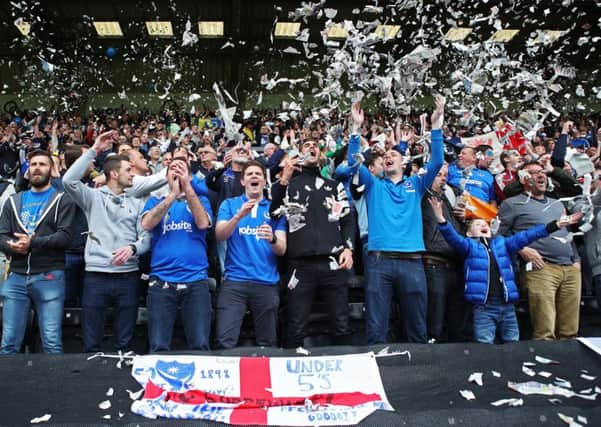 Pompey fans greet the players with ticker-tape before the game. Picture: Joe Pepler