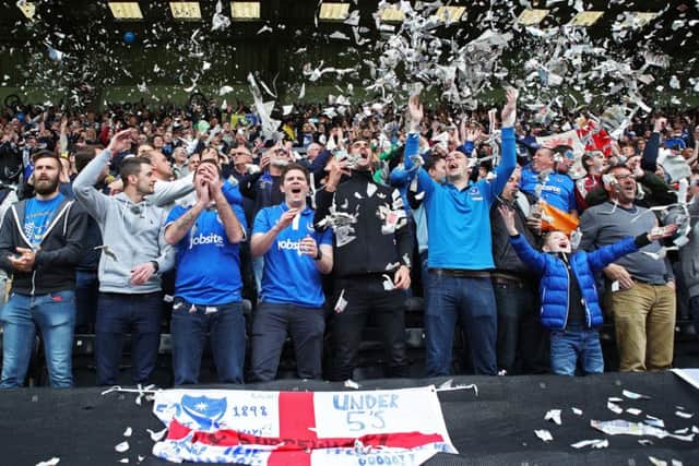 Pompey fans greet the players with ticker-tape before the game. Picture: Joe Pepler