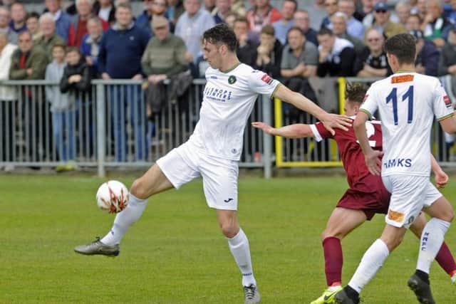 Jason Prior holds off Rocks player Calvin Davies. Picture: Ian Hargreaves