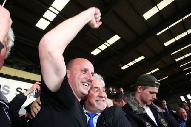 Pompey boss Paul Cook celebrates with chairman Iain McInnes. Picture: Joe Pepler
