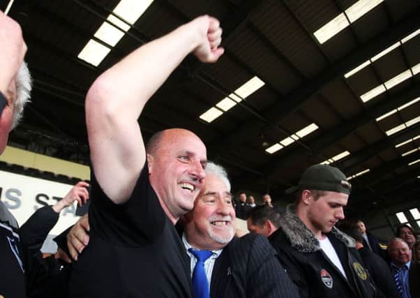 Pompey boss Paul Cook celebrates with chairman Iain McInnes. Picture: Joe Pepler