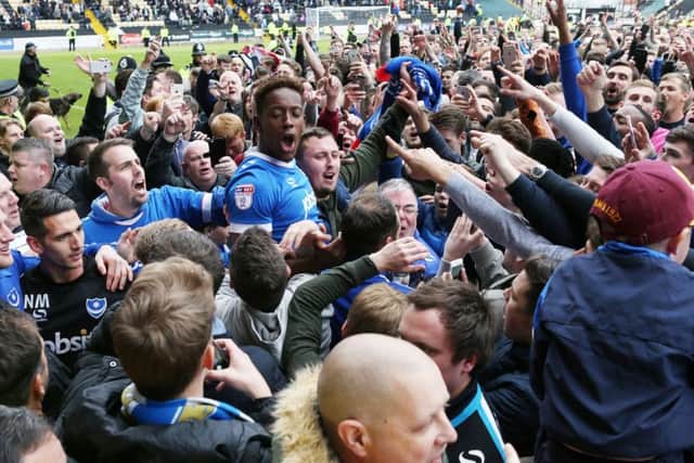 Jamal Lowe celebrates with Pompey fans at Meadow Lane. Picture: Joe Pepler