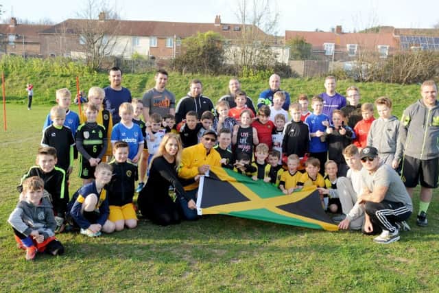 The director of football at Padnell Rovers FC in Paulsgrove, Steve Clarke (yellow jacket), took club kits to Jamaica Picture: Sarah Standing (170465-5581)